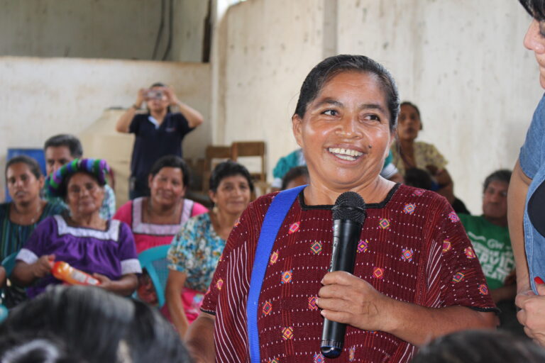 Woman in Guatemala engages in her savings group as part of Desde el Poder Local
