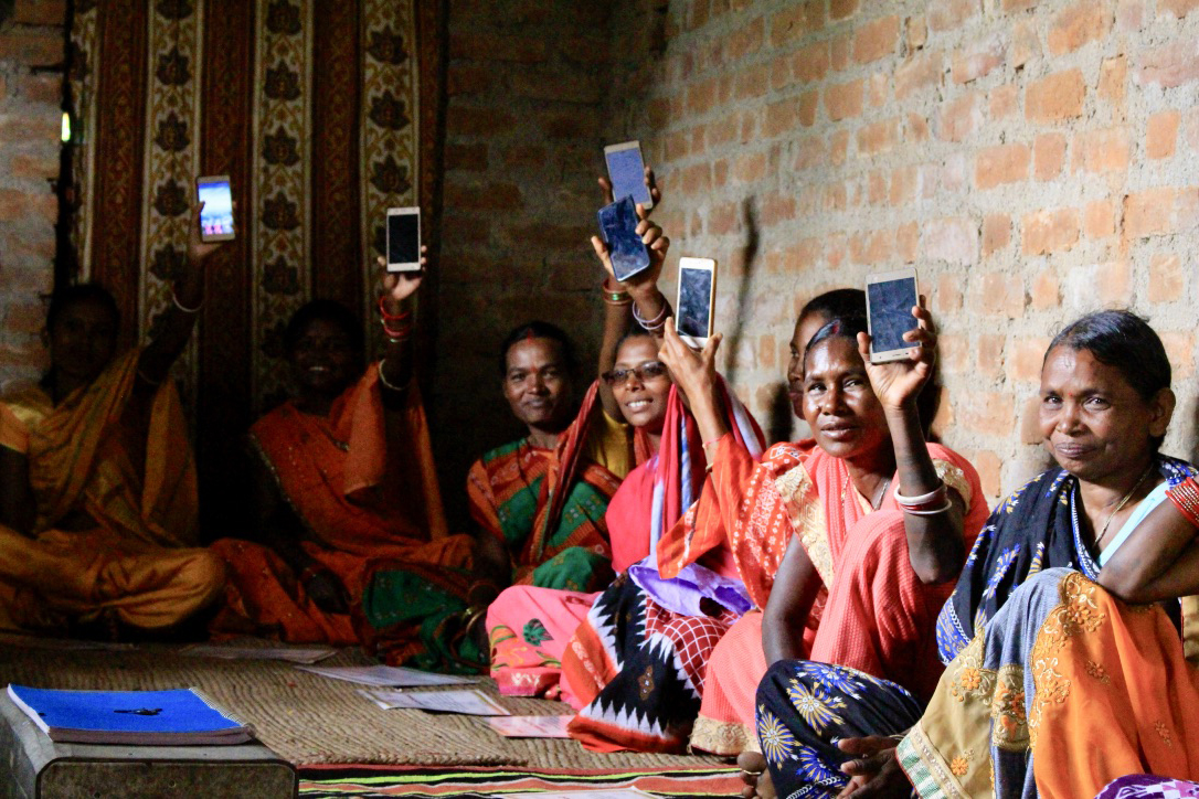 EQUALS participant uses a smartphone during digital literacy training.